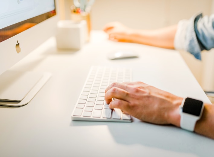 person using iMac