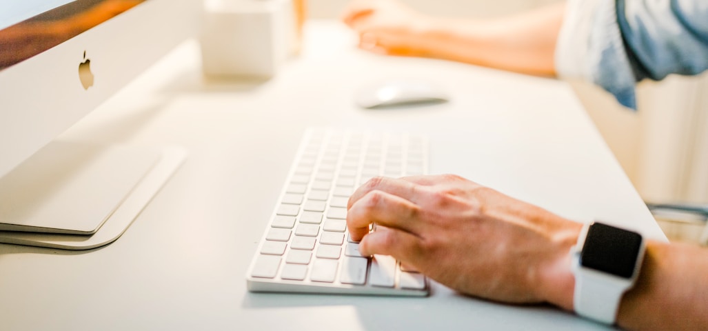 person using iMac