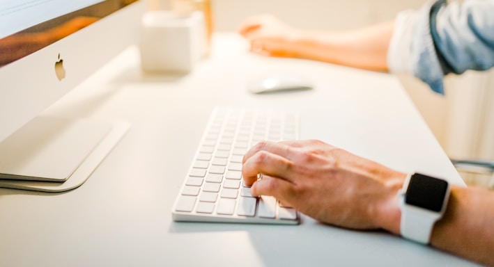 person using iMac