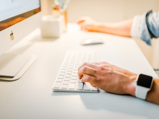 person using iMac