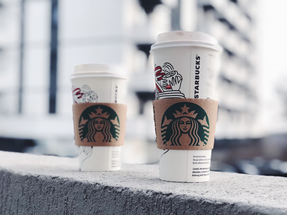 two Starbucks cups