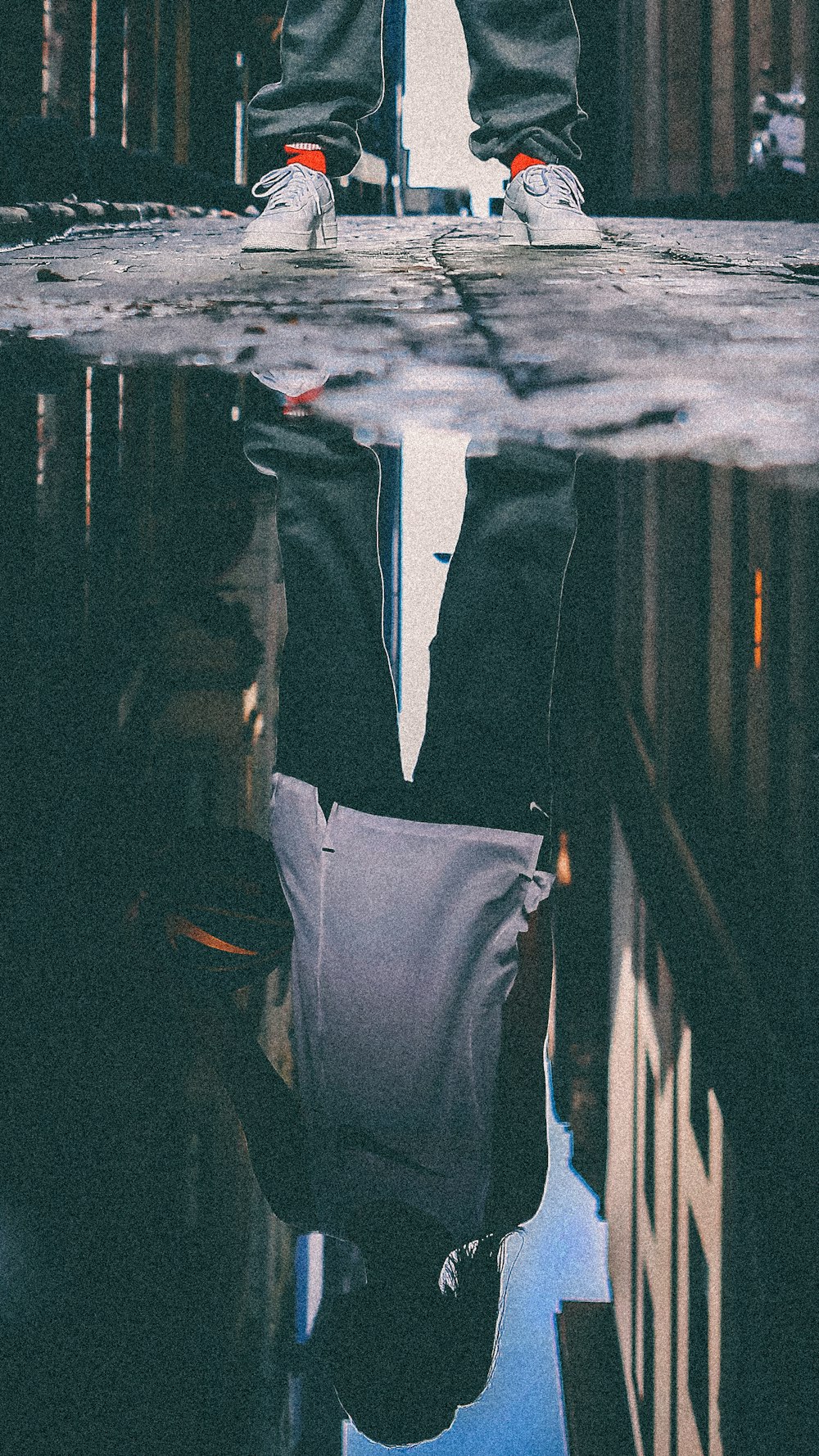 person's reflection in water during daytime