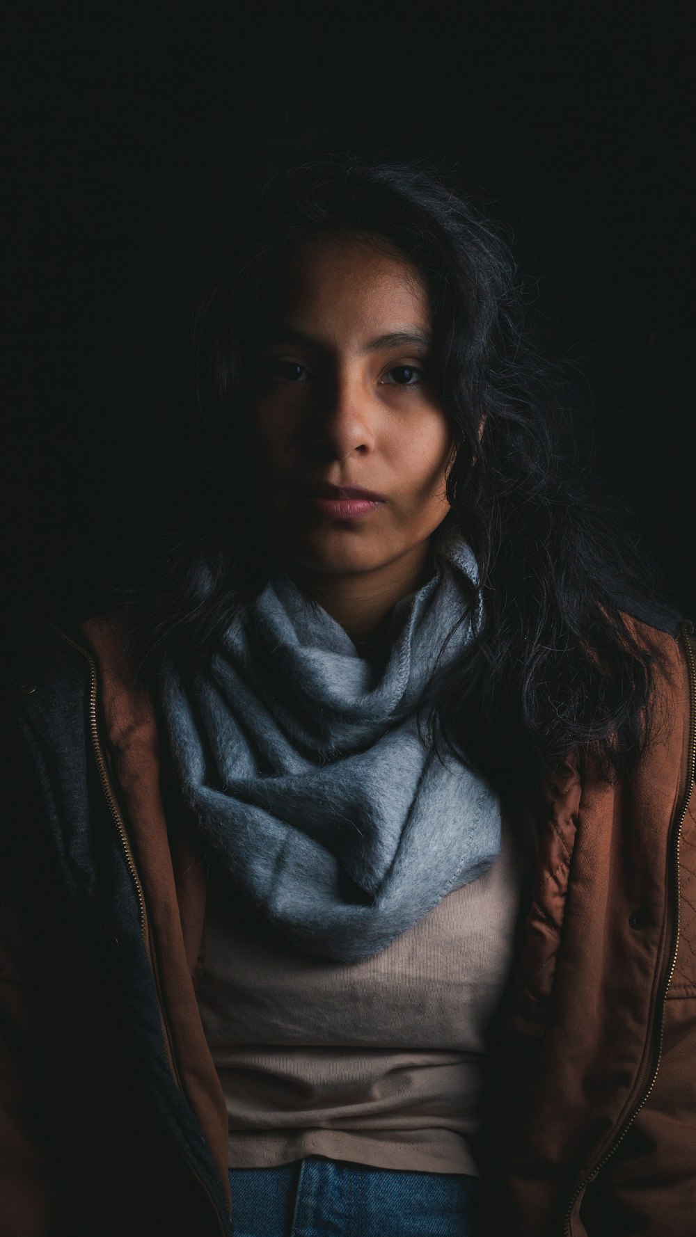 woman wearing brown and blue jacket