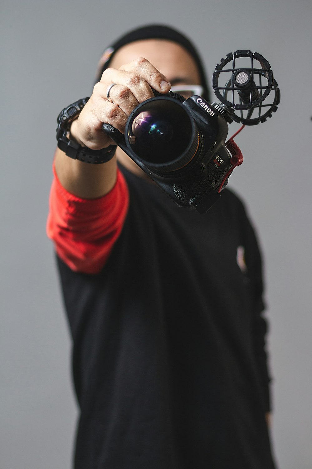 person holding black camera