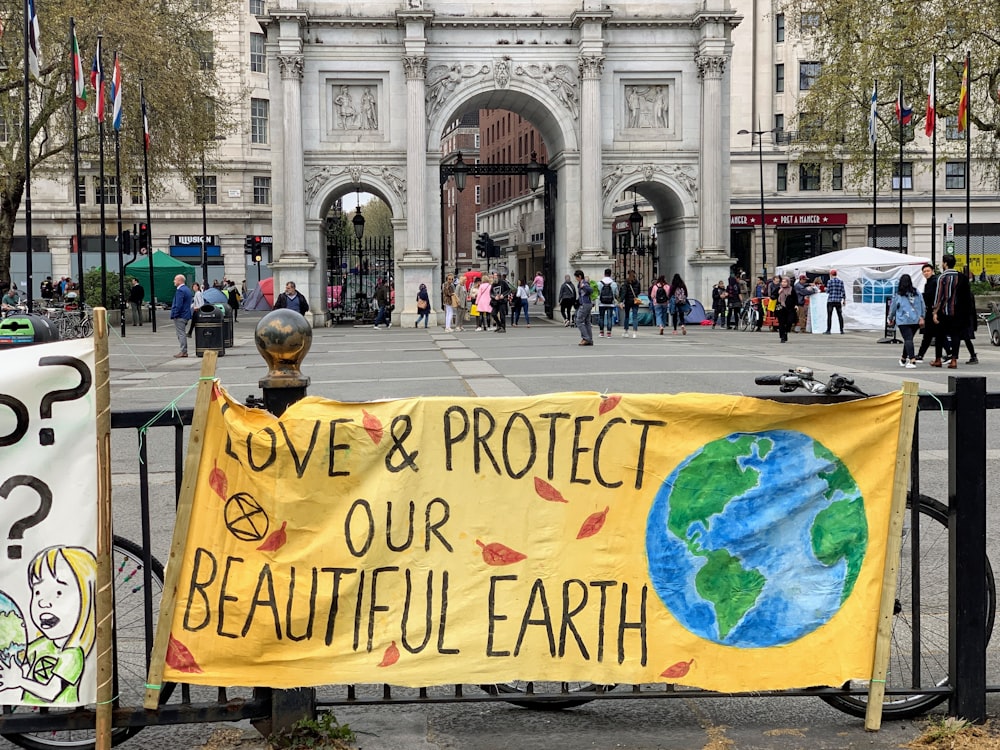 Sign that says "Love & Protect our Beautiful Earth"
