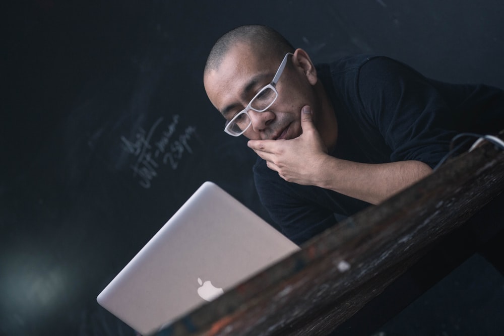 man using silver MacBook