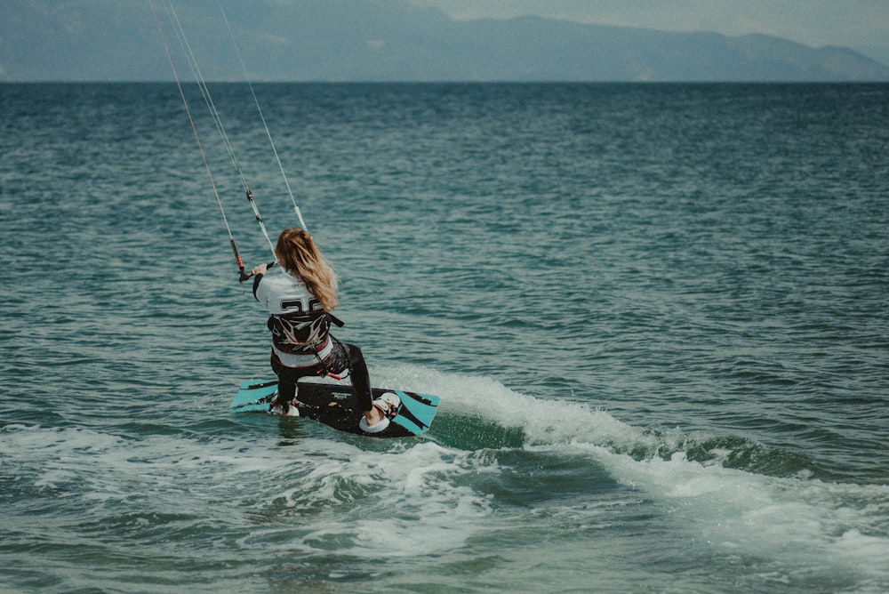woman riding on wakeboard
