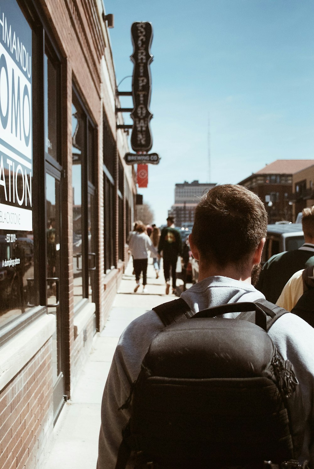 man walking on pathway during daytime