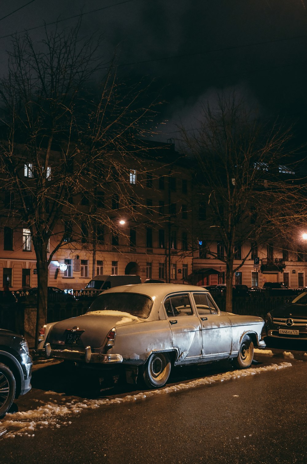 gray sedan outdoor during night time