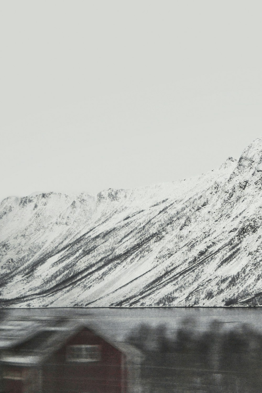 snow-covered mountain by the lake