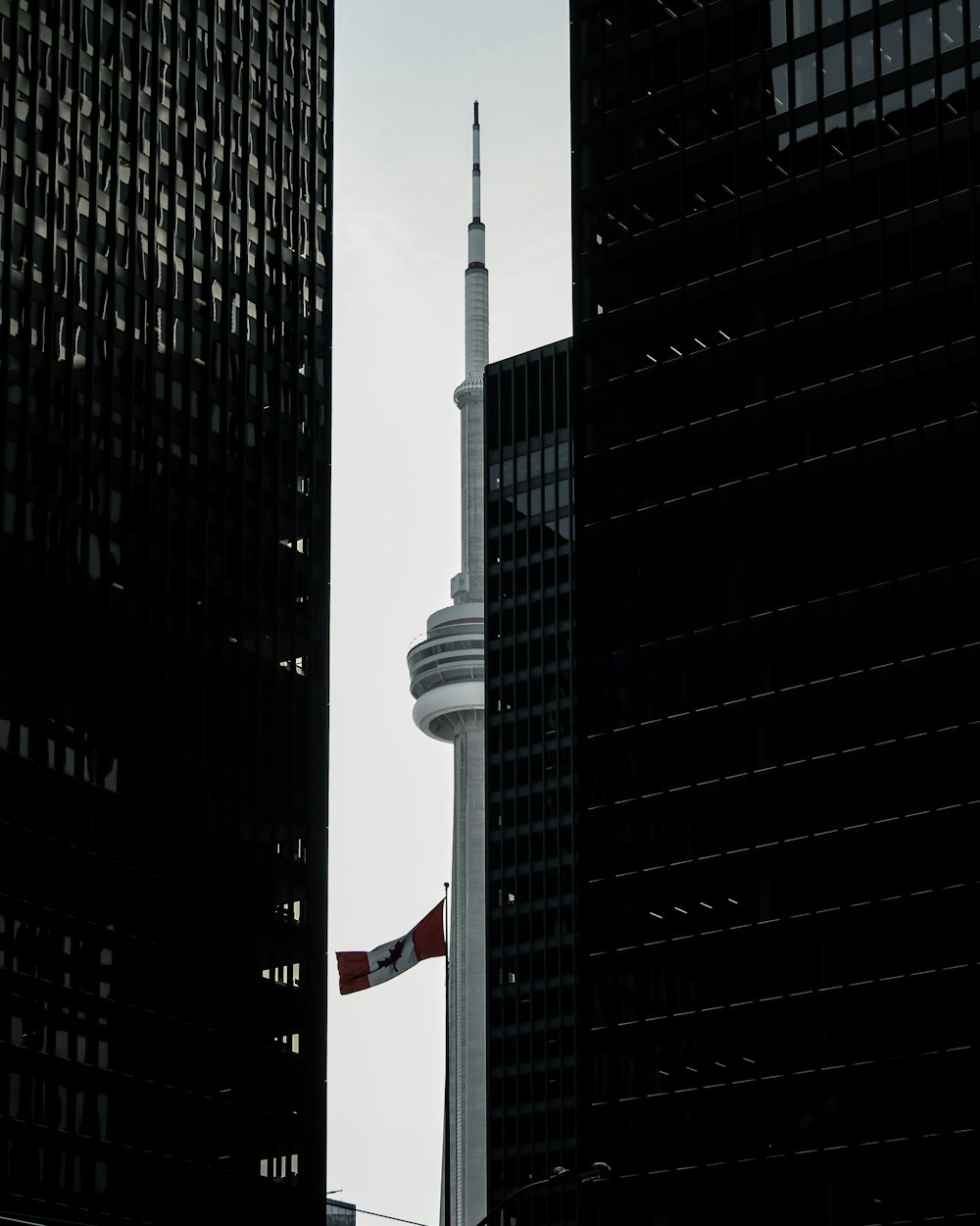 gray tower between buildings