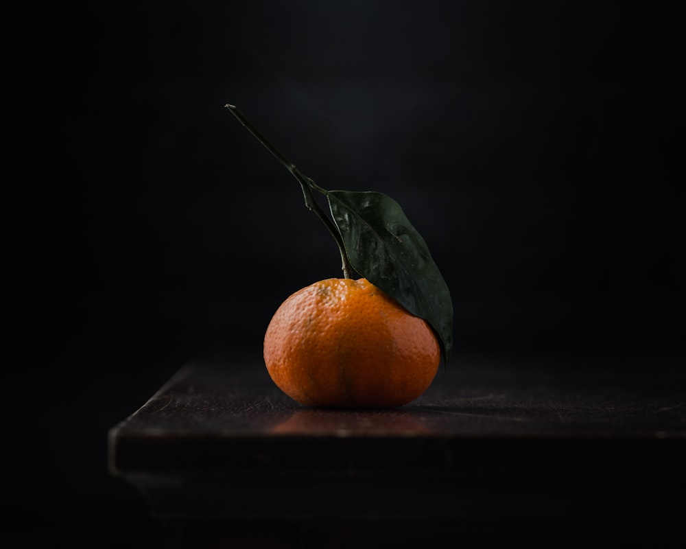 orange fruit on black surface