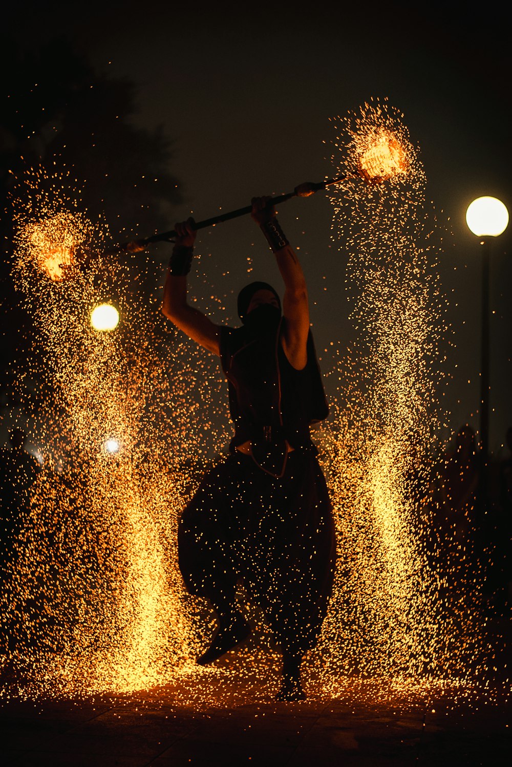 man doing fire dancing during nighttime