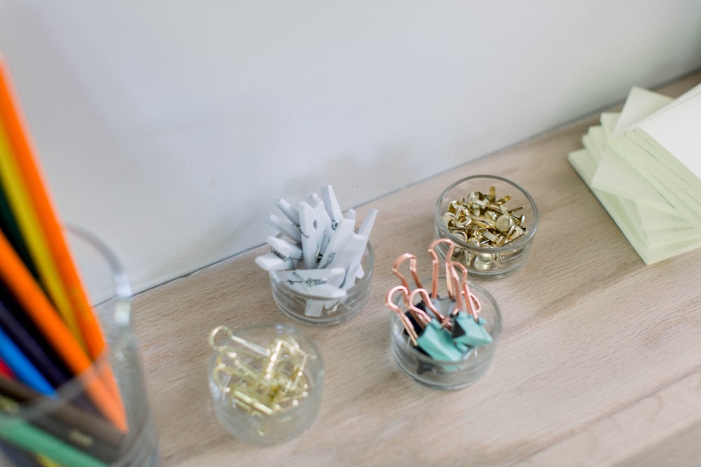 four clear glass containers