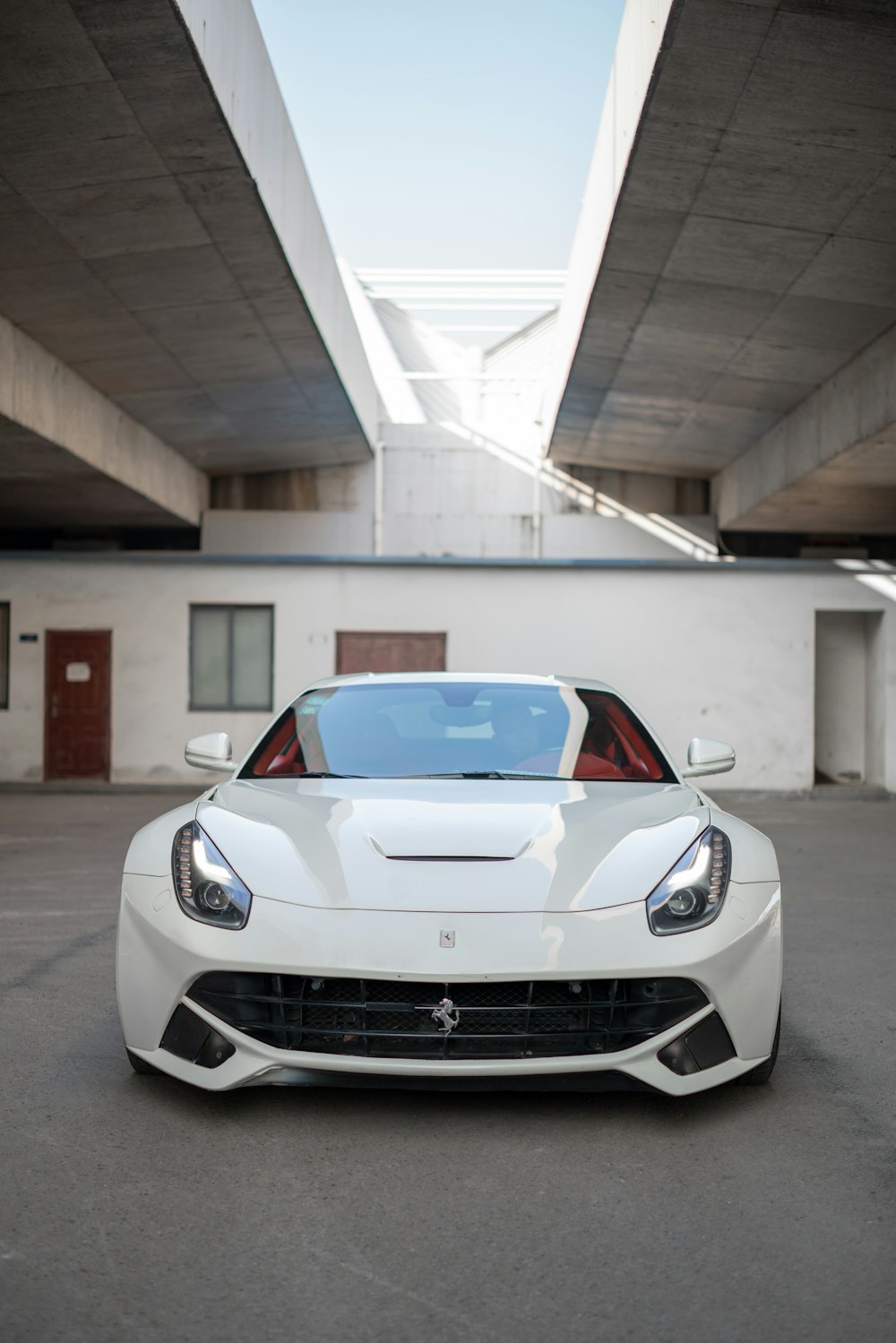 white car parked inside garage