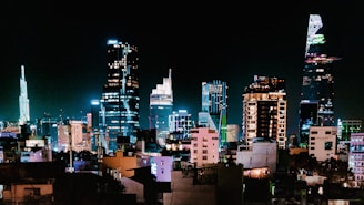 a view of a city at night from a rooftop