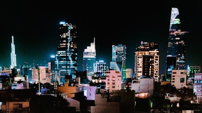 a view of a city at night from a rooftop