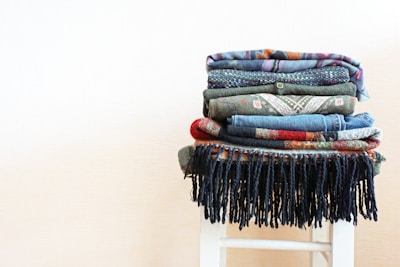 Stacks of vibrant textiles ready for global shipment from stitch&soul.