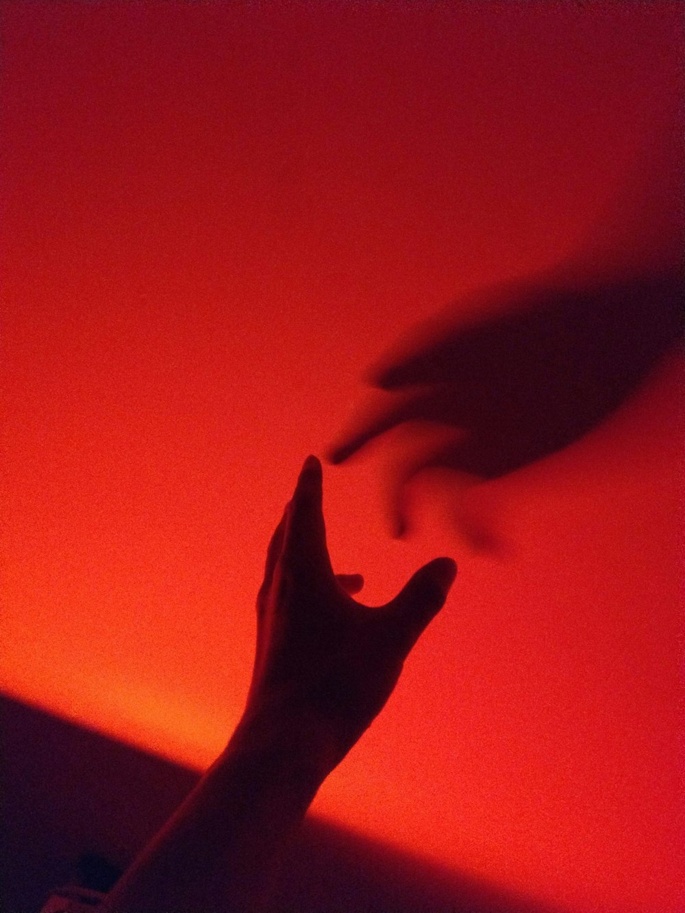 person's hand with shadow