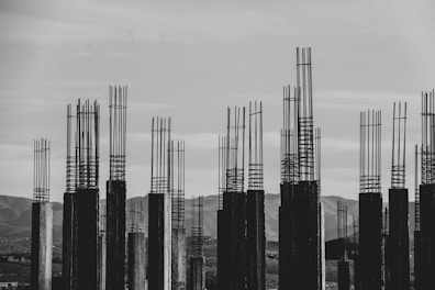 grayscale photography of concrete posts