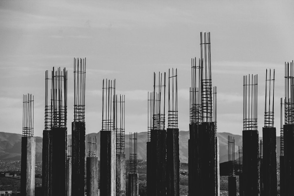 grayscale photography of concrete posts