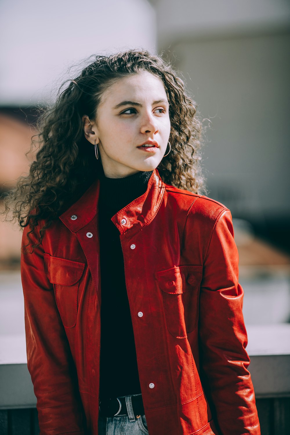 woman wearing red leather jacket