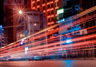 timelapse photography of vehicle near building