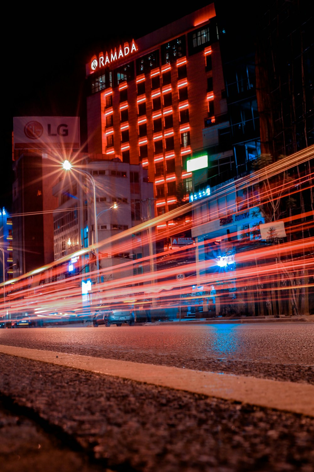 timelapse photography of vehicle near building