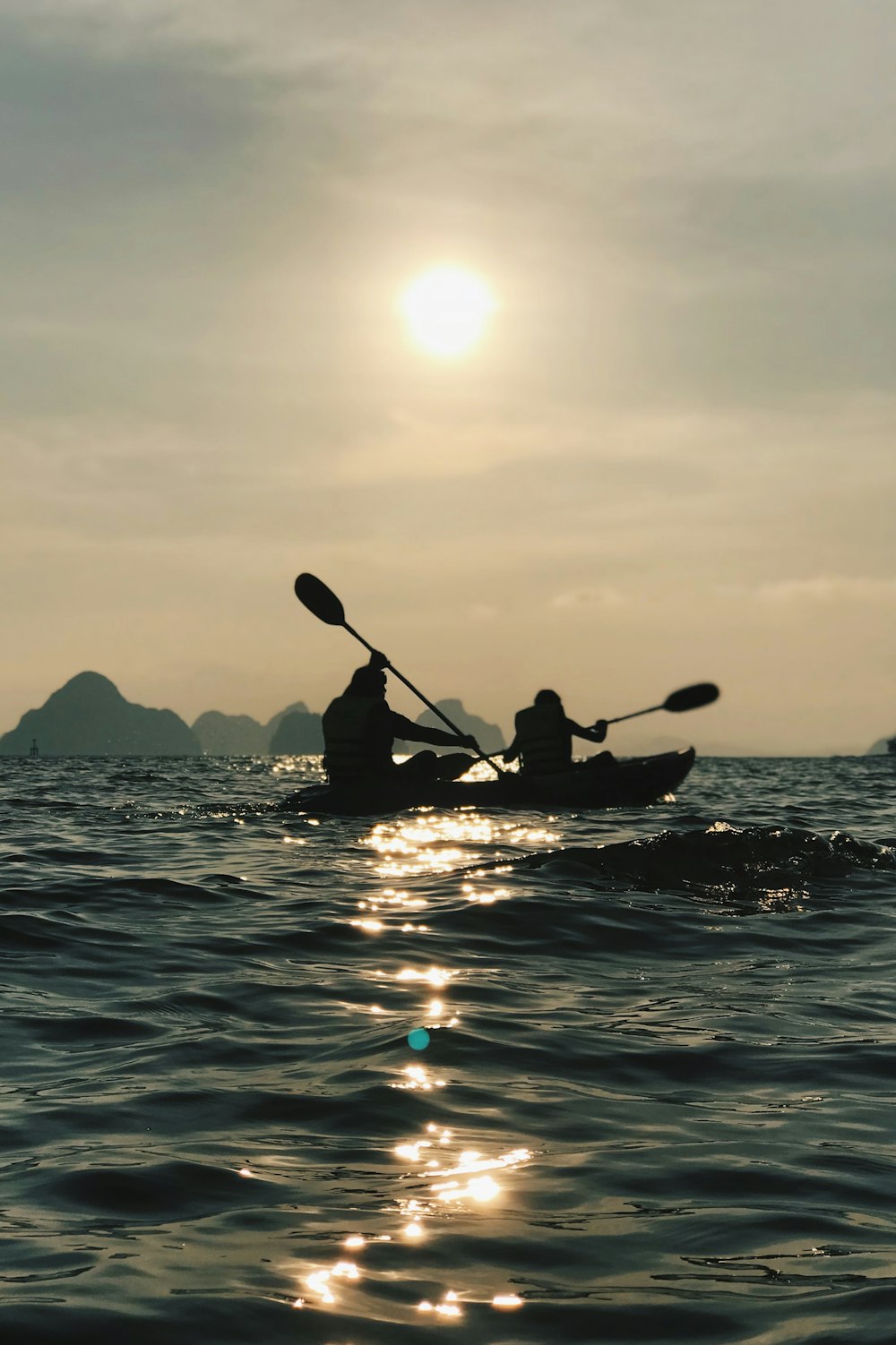 silhouette photo of person riding on boat