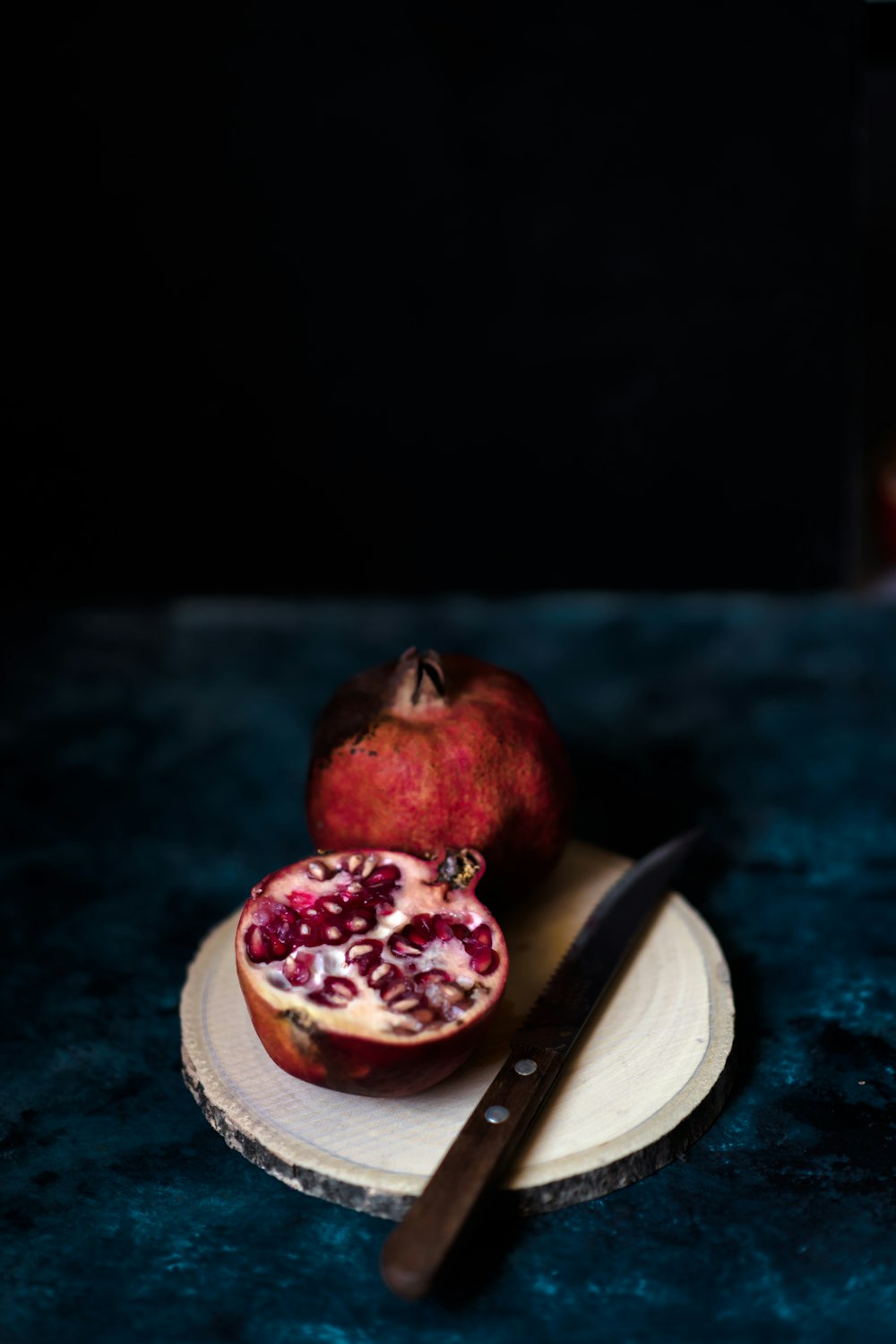 pomegranate on white saucer