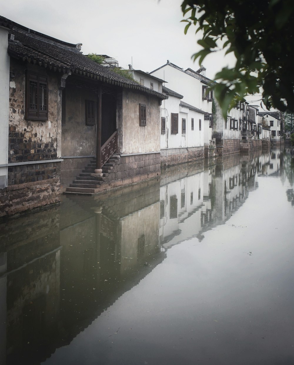 flooded white and brown concrete houses during daytime
