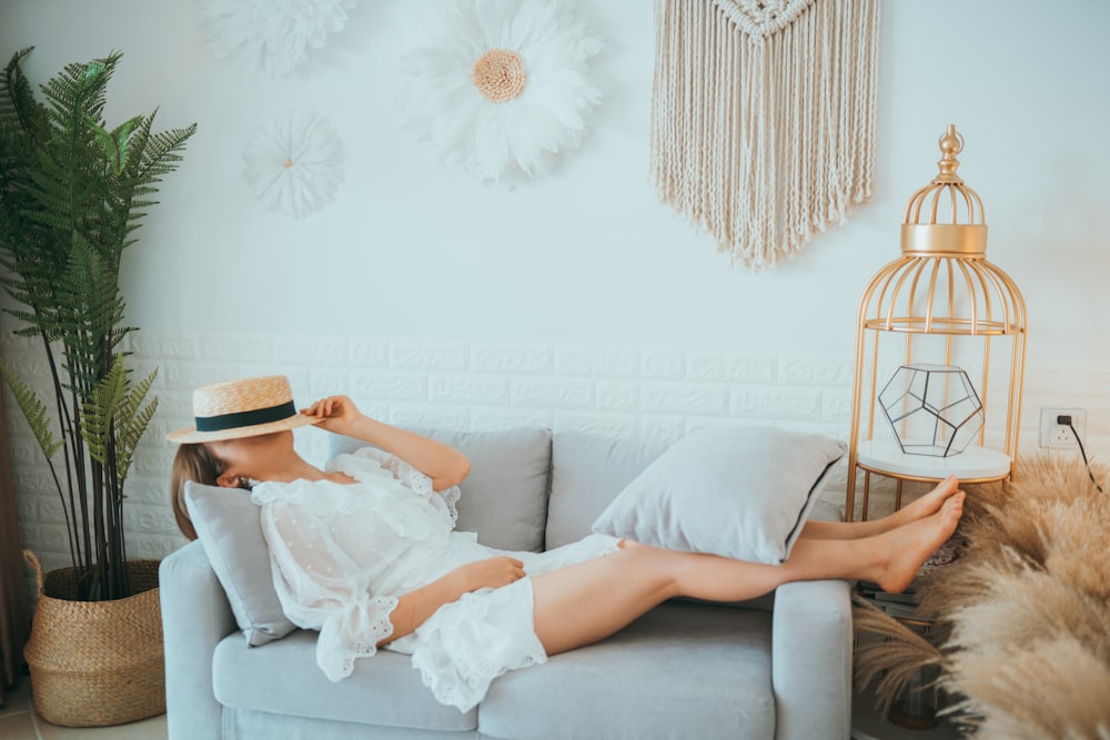 woman lying on sofa