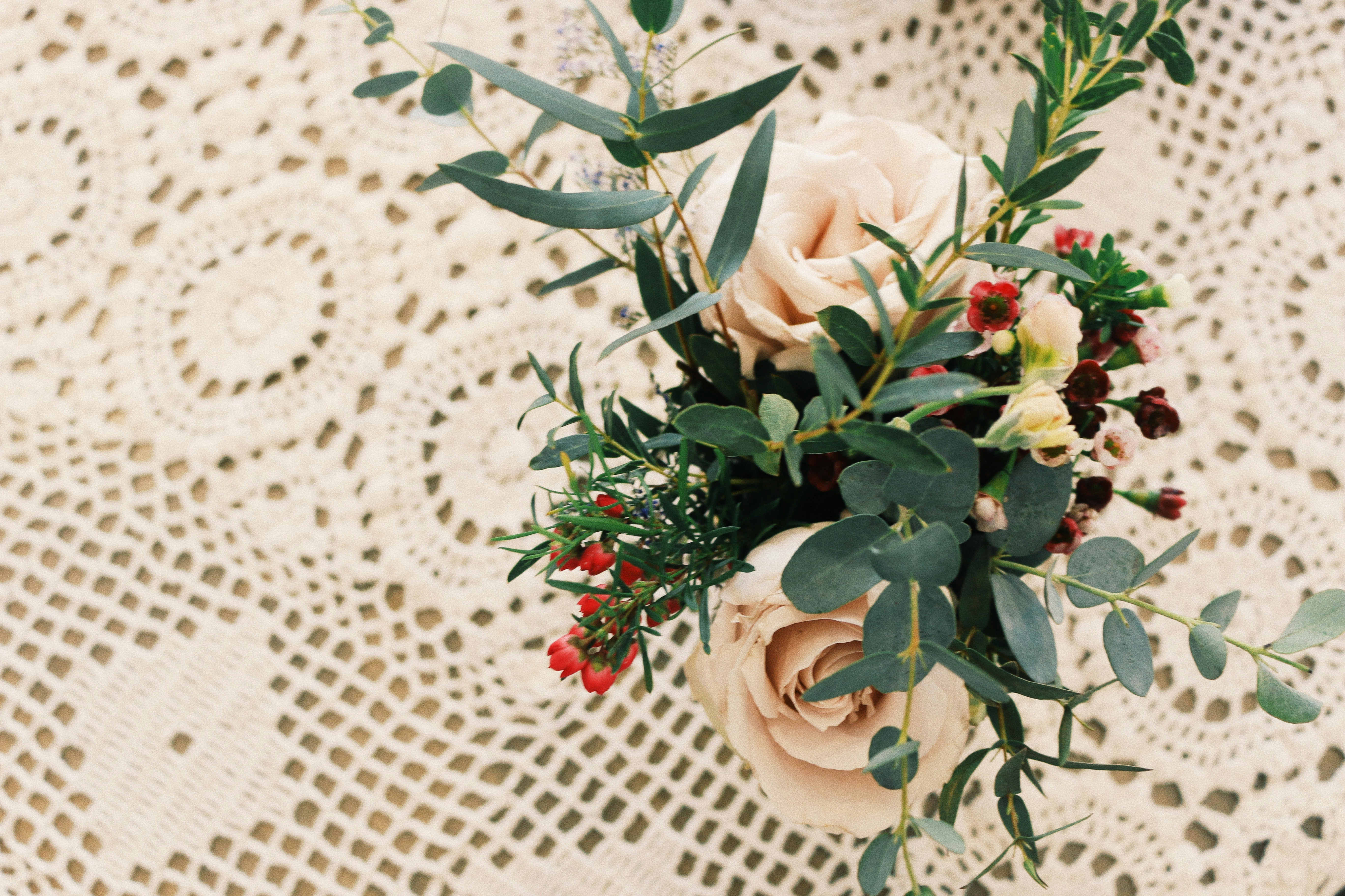 Soft blush mixed flower centerpiece with peonies, roses and lisianthus