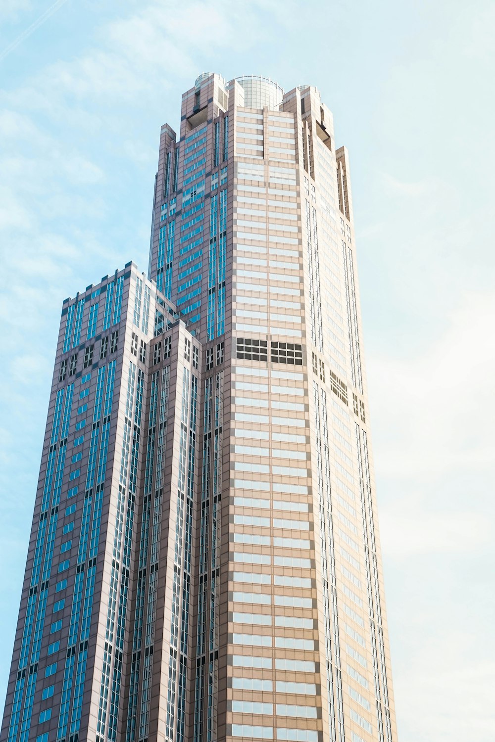 grey high-rise building under blue sky