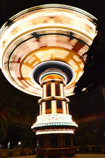 Guests enjoying a 360-degree spinning platform capturing dynamic videos at a lively event.