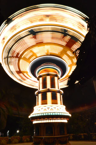 Guests enjoying a 360-degree spinning platform capturing dynamic videos at a lively event.