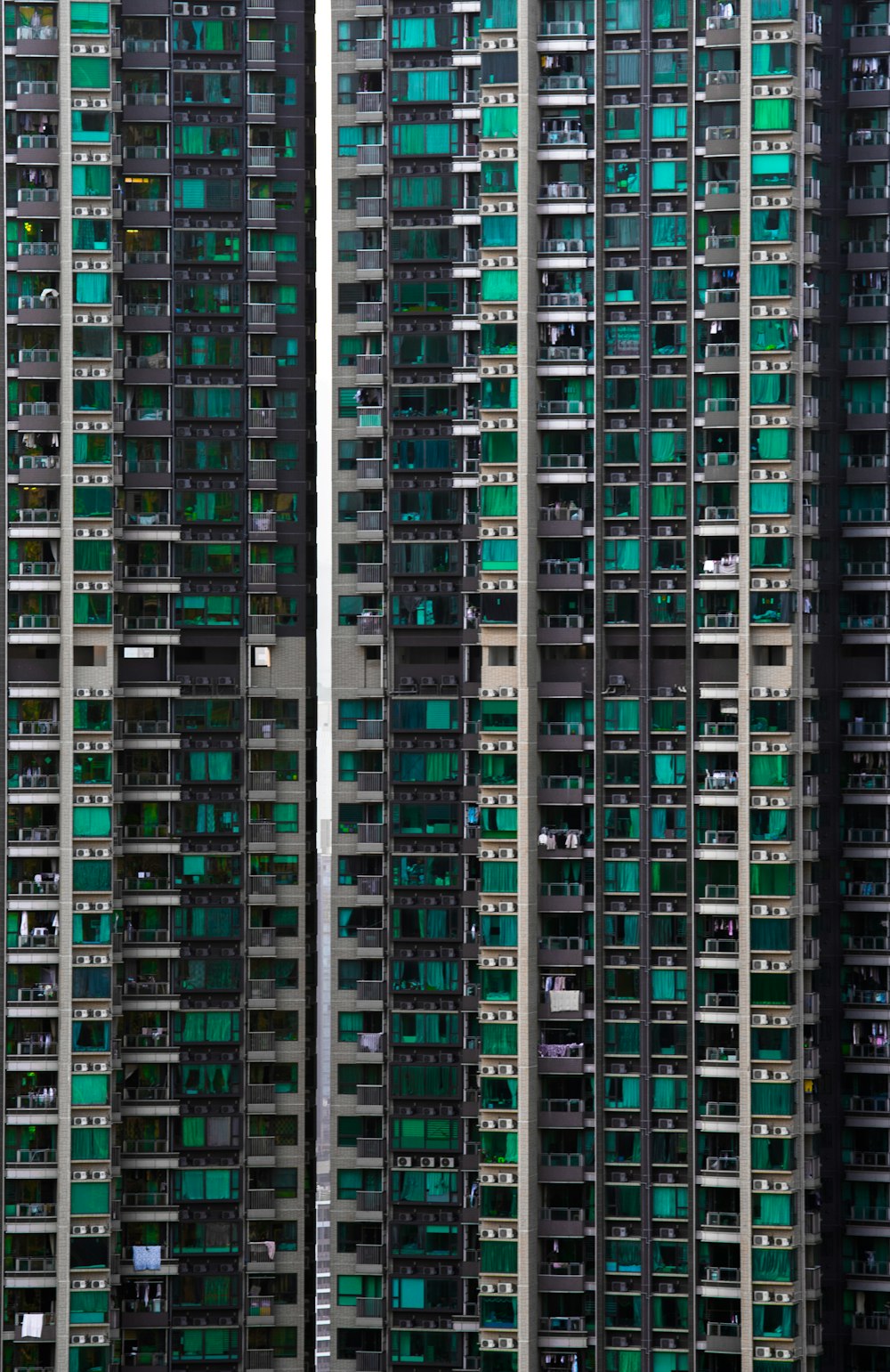 a very tall building with lots of green windows