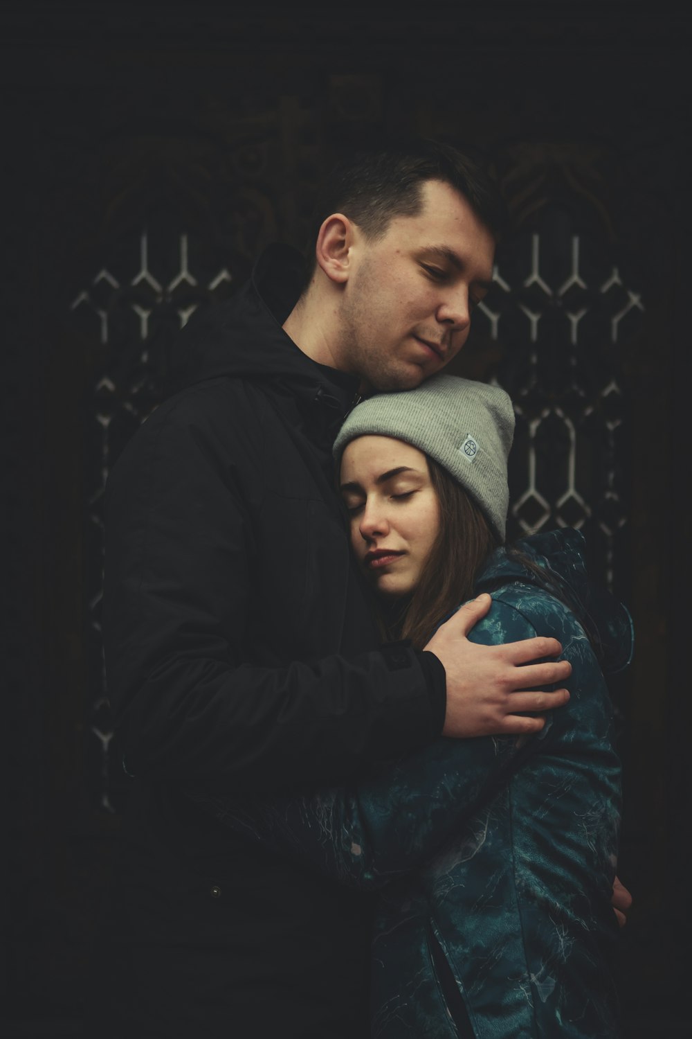 man and woman standing near wall