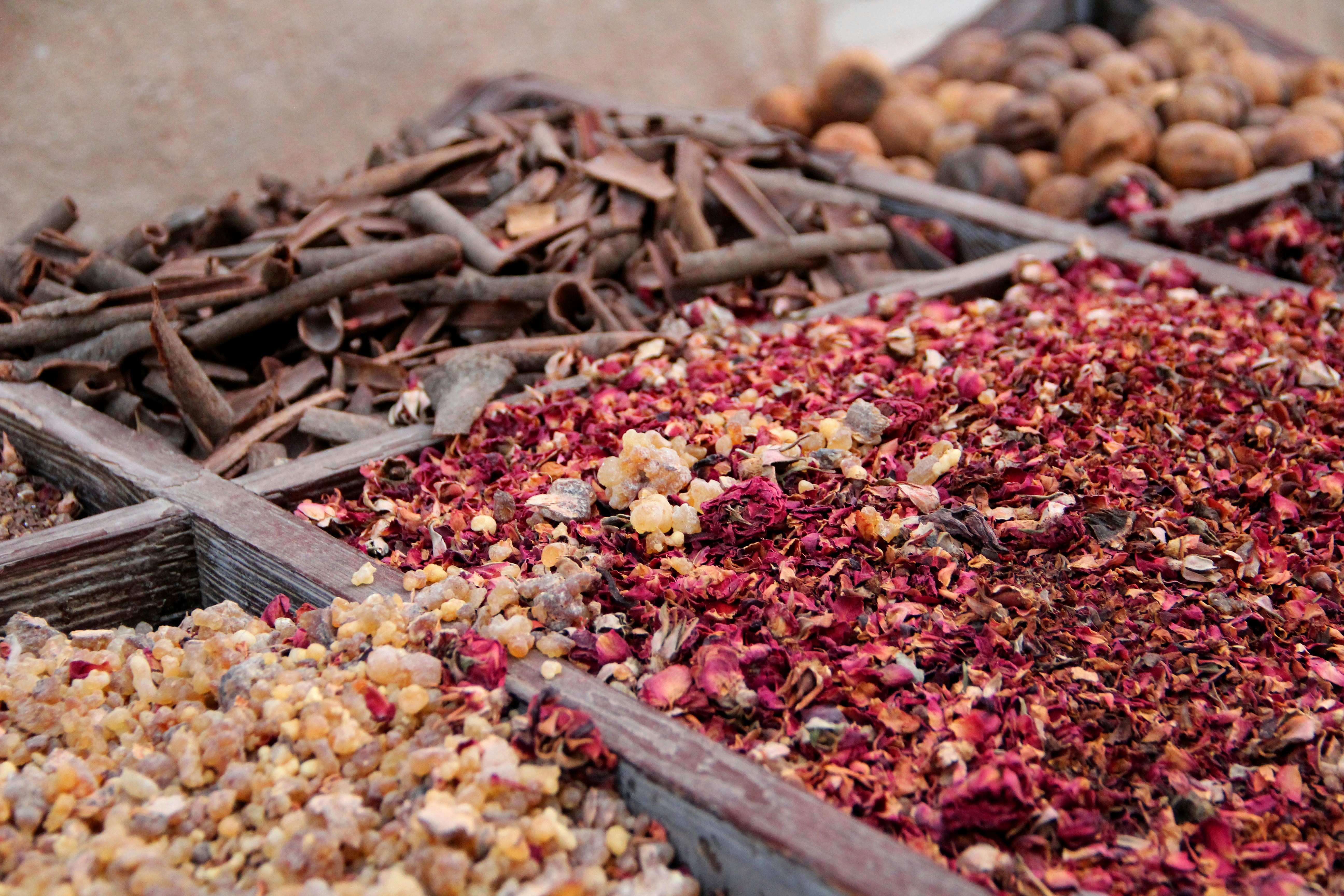 variety of spices on wooden crates