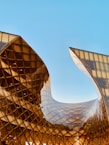 structural photography of amber glass building