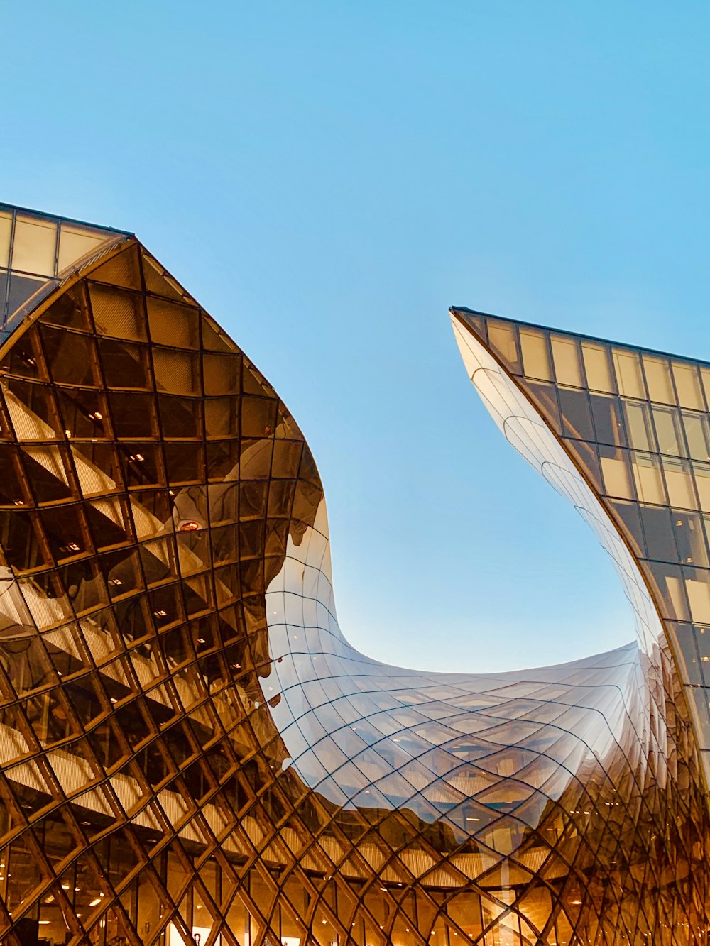 structural photography of amber glass building
