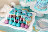 cake pops with cupcakes on tray