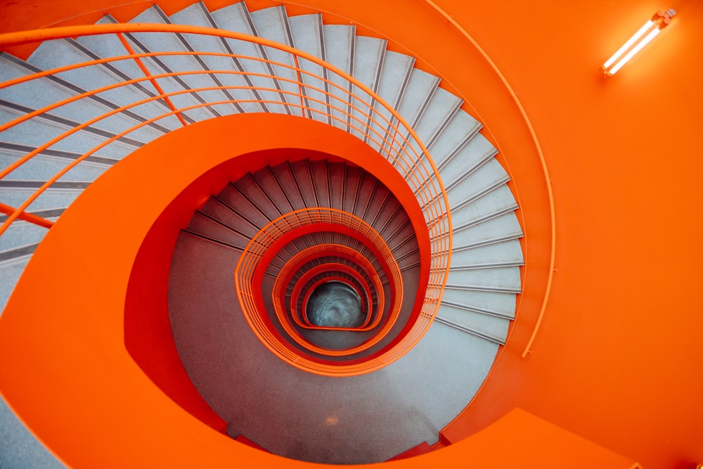 gray and orange spiral stairs