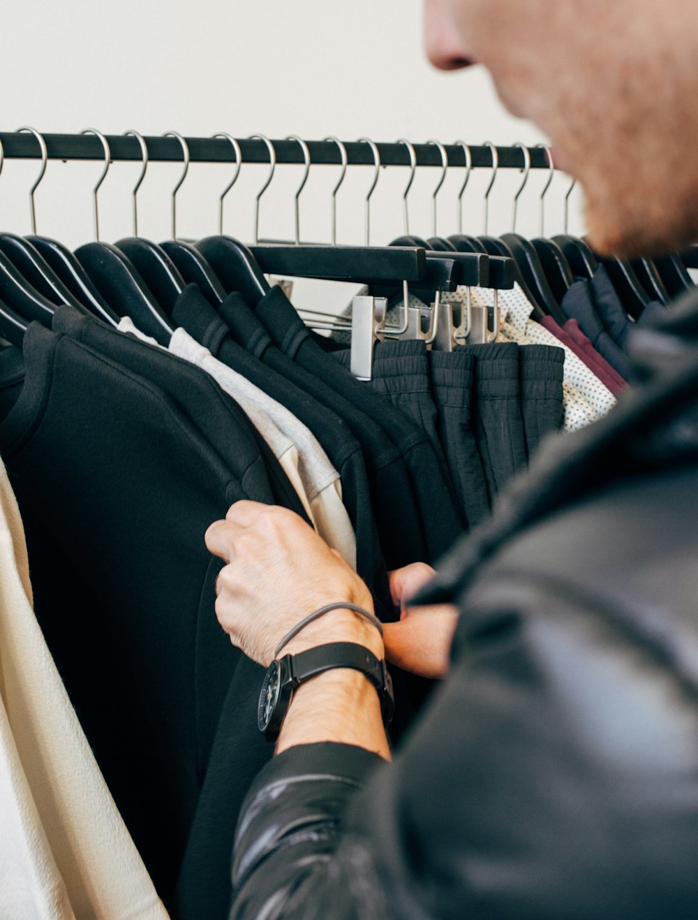 man holding black shirt