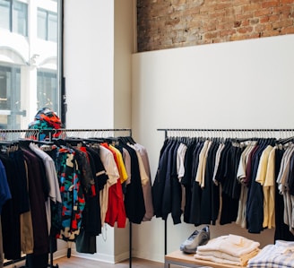 assorted-color clothes hanging on metal racks