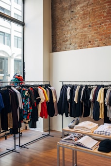 assorted-color clothes hanging on metal racks