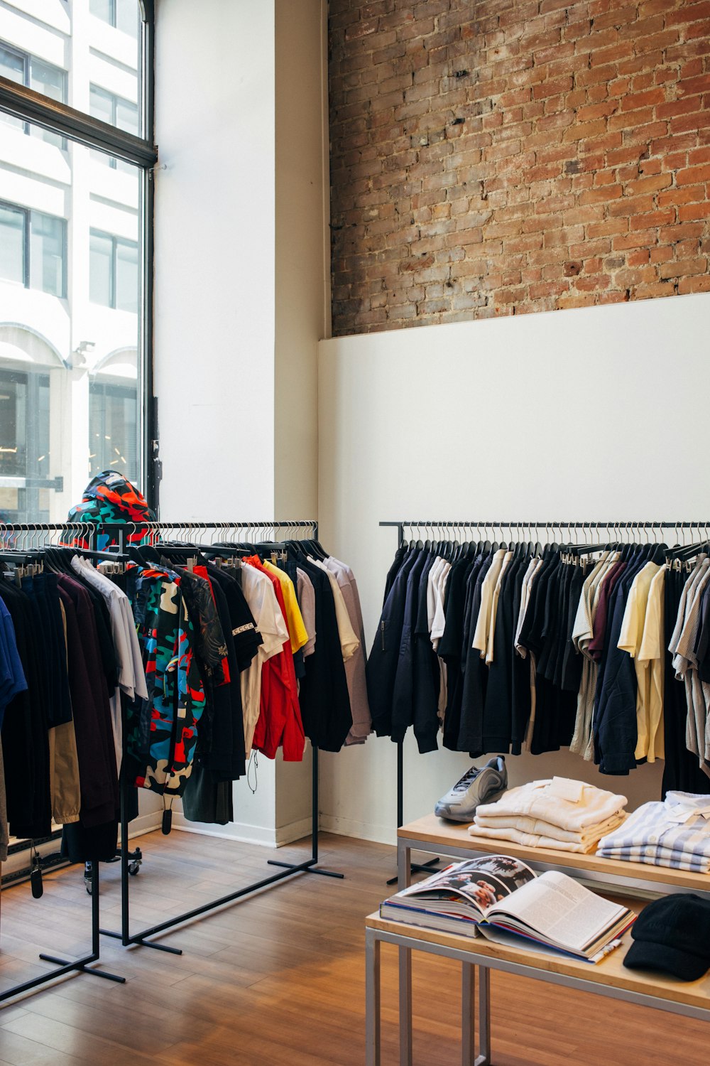 assorted-color clothes hanging on metal racks