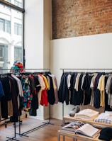 assorted-color clothes hanging on metal racks