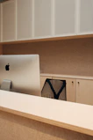 A modern office desk setup with ergonomic accessories and sleek organizers