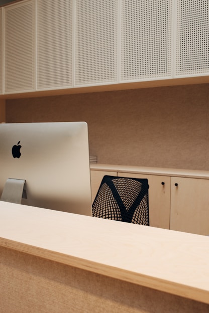 A modern office setup featuring an office table and chair.